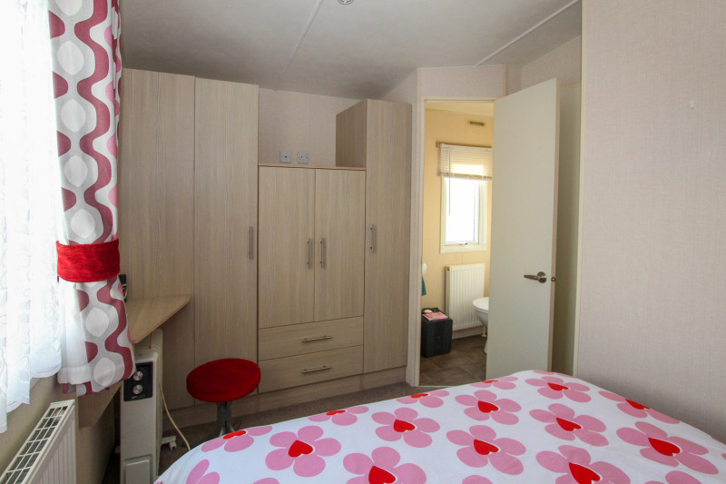 Victory Vision 2014 + decking at Pevensey Bay Holiday Park, East Sussex. 3 bedrooms / 6 berth